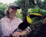 Susan Strehle makes the acquaintance of a tame toucan.